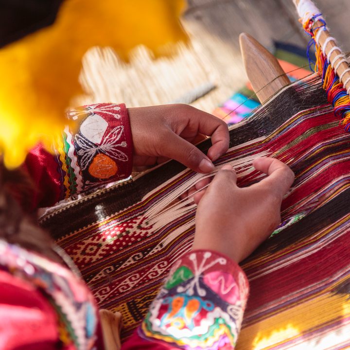 Woman weaving traditional textiles in the Sacred Valley