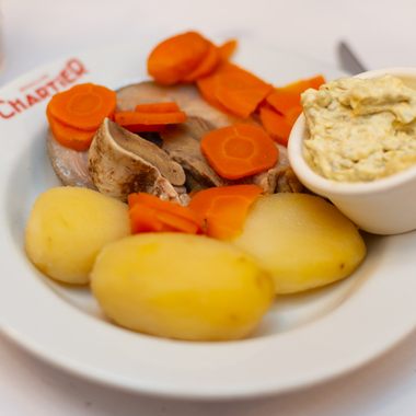 Humble pot-au-feu is considered one of definitive staples of French cuisine.