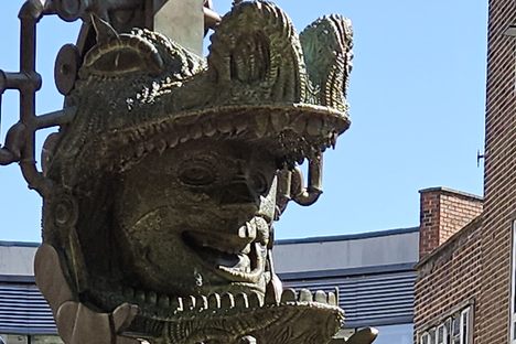 The statue with the entrance to the Ridings Shopping Centre in the background.