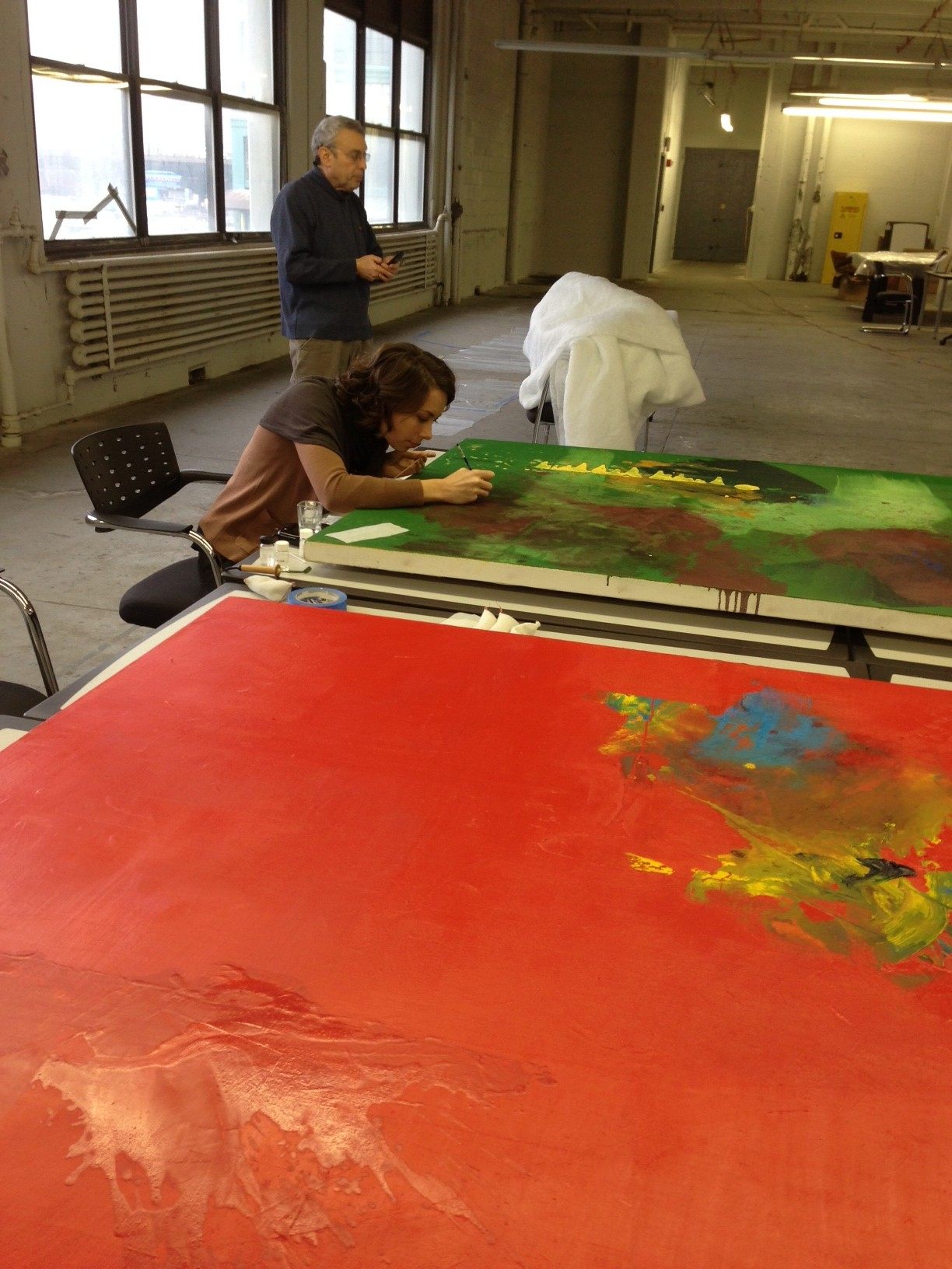 A work-in-progress, where  paintings generally had to be removed from the stretchers, cleaned with an alcohol solution, and re-stretched. 
