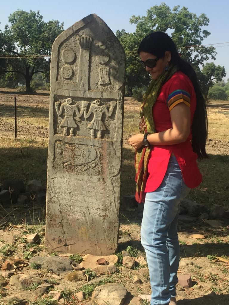 Ameeta Singh with one of the sculpted sati stones that she seeks out and documents.