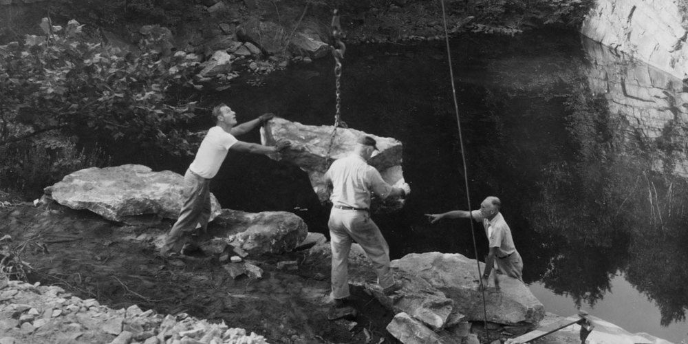 Russel Wright (at right) orchestrating the placement of a large rock during the construction of Manitoga.