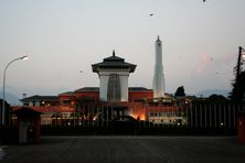 Night view of the palace with Kathmandu’s famous giant fruit bats flying overhead.