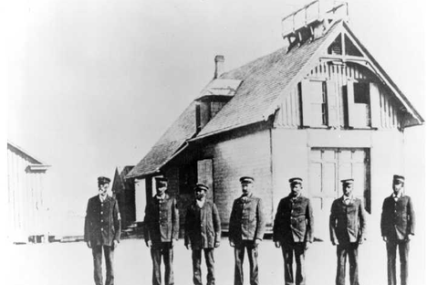Richard Etheridge, left, with his crew in front of Pea Island lifesaving station, circa 1896.