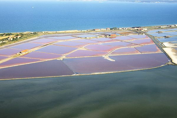 An aerial view of the pink waters of Lake Atanasovsko.