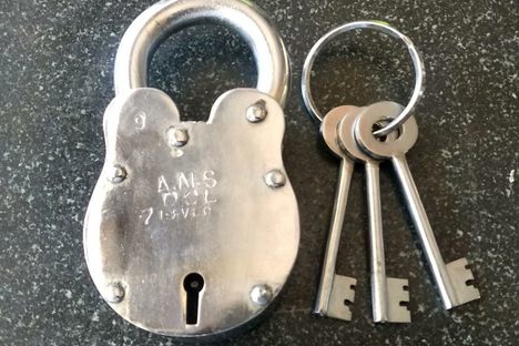 The mango button lock opens only when you turn the key after pressing a hidden button. 