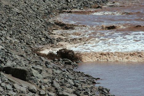 The Moncton tidal bore laps the shore