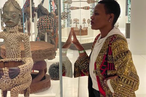 Activist Sylvie Njobati sees the statue of Ngonnso for the first time at the Humboldt Forum in Berlin.
