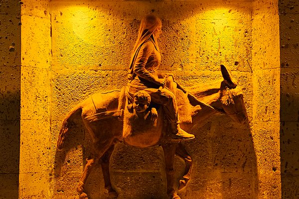 The rear panel on Çanakçı Heykeli featuring a woman on a donkey.