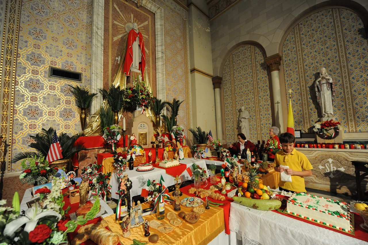 Common foods on St. Joseph altars include <em>cucidati</em>, or fig cookies, and <em>pignolata</em>, or "honey ball" cookies.