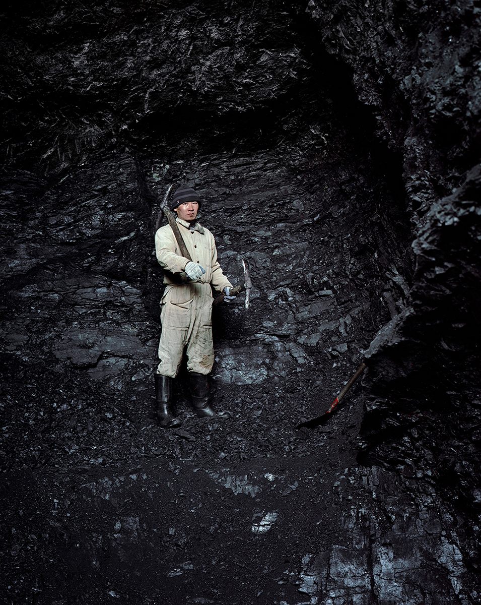 A coal miner in Min Kush. The city was known for its uranium, but there are also coal reserves. The workers walk three miles into the mountain each morning.