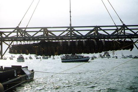 The wreck oof H.L. Hunley, suspended from a crane during its recovery from Charleston Harbor, August 8, 2000. 
