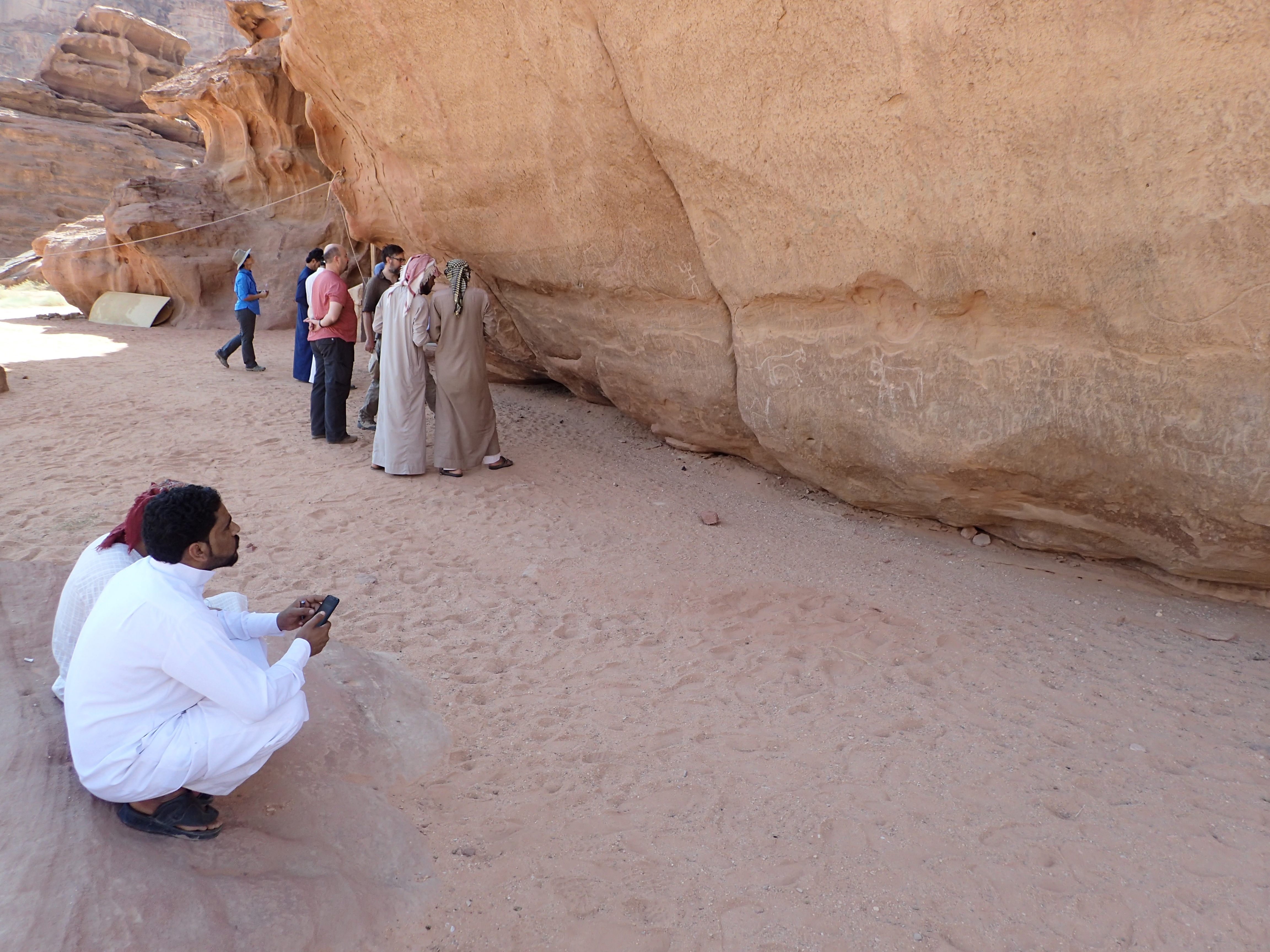 Local Bedouins assess rock art panels as part of the training program.