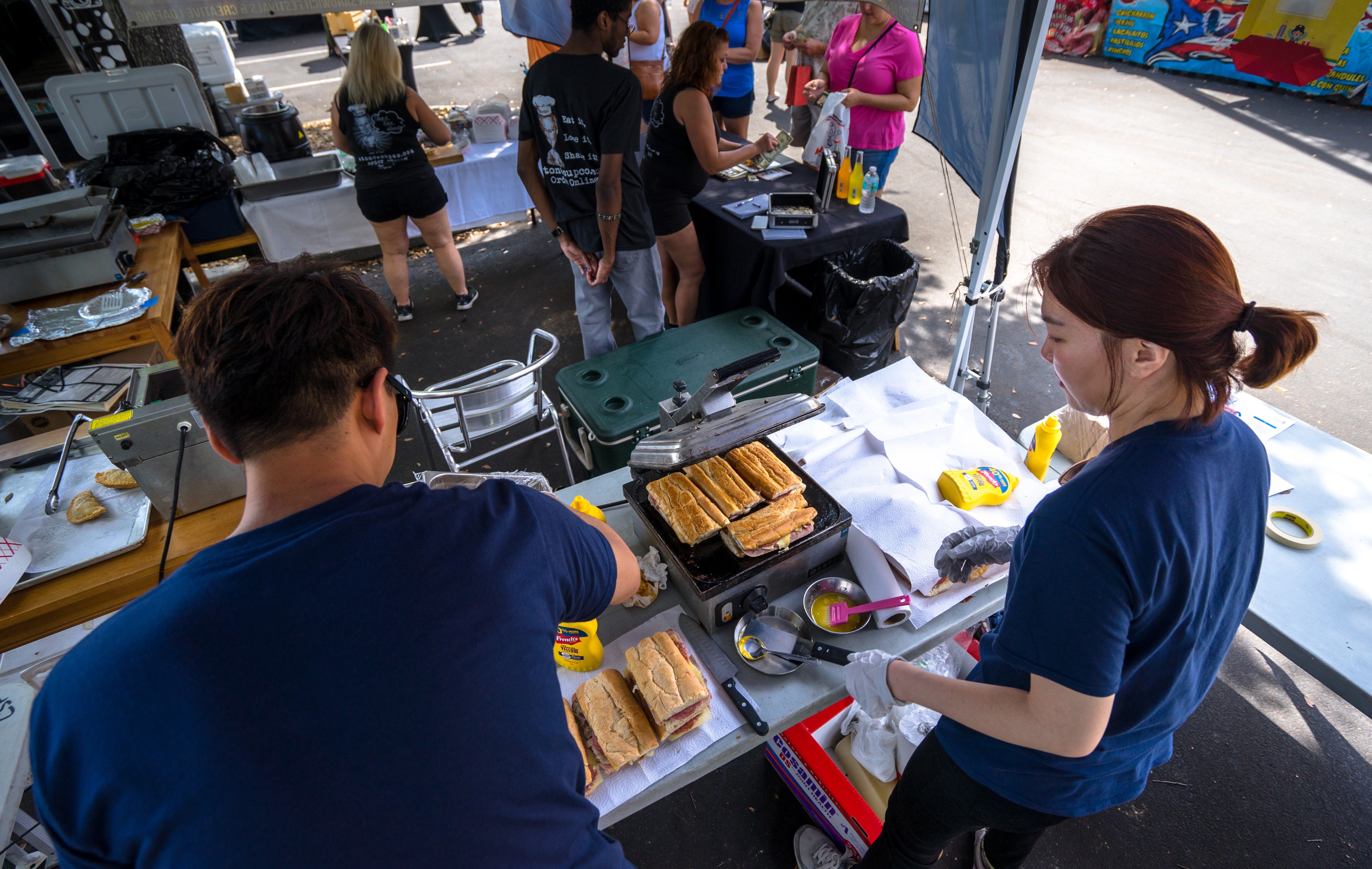 Kang and Cho working on making Cubans at the competition.