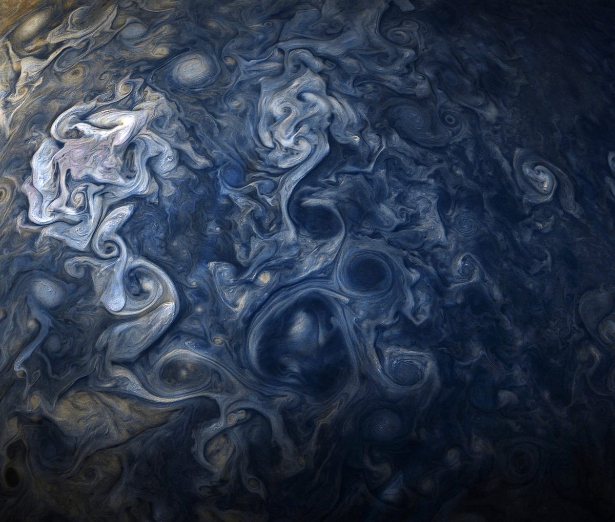 A color-enhanced image Jupiter's cloud systems, shot by <em>Juno</em>, October.