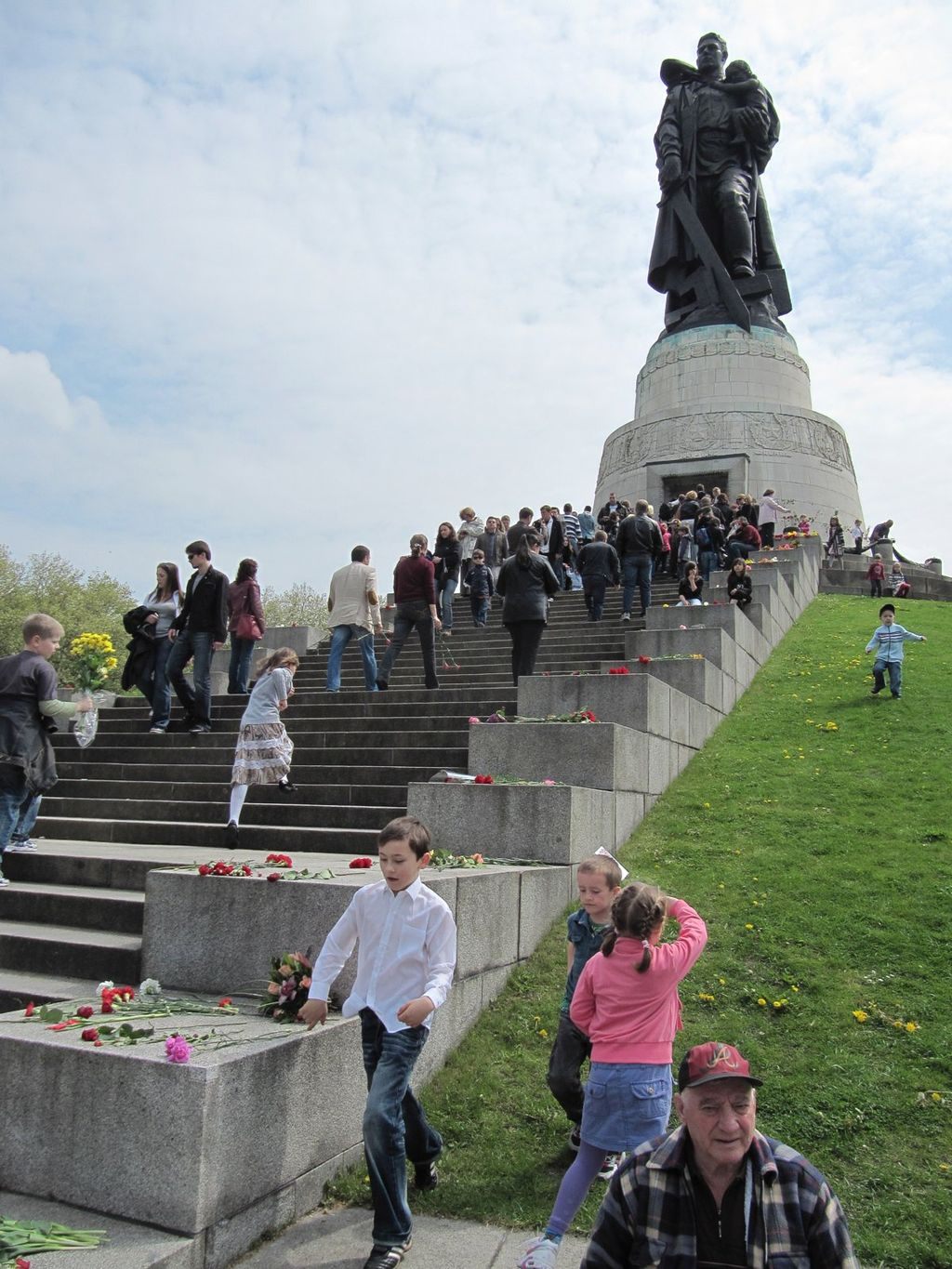 People celebrating the 65th anniversary of the Red Army's victory over Germany at the Soviet War Memorial in Berlin.