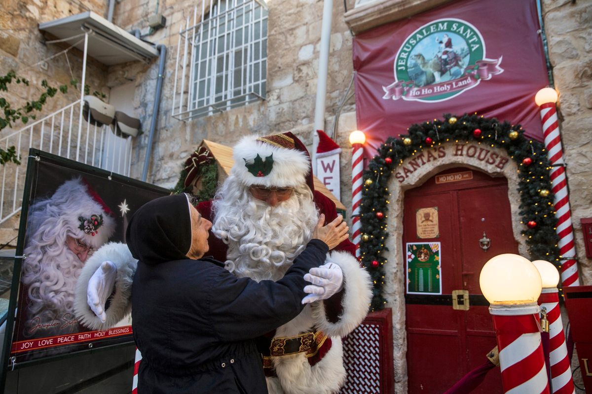 Issa Kassissieh hugs a nun outside his family’s 700-year-old home.