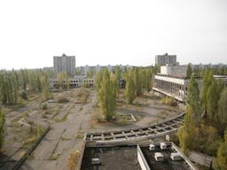 The center square of Pripyat, once home for 50,000 people. After 22 years of neglect, nature has started to seep through the concrete 