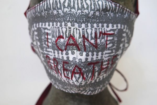 The print on artist Melinda Shcakhofer's mask is based on an 18th-century engraving of a slave ship. 