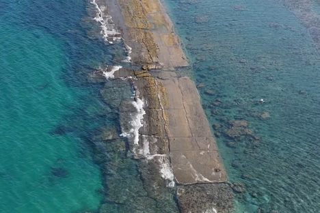 The submerged wall becomes visible during exceptionally low tides along the coast of Nhon Hai, Quy Nhon.