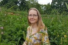 The plants around Liz Dauncey in this photo are not poisonous, but many common garden and houseplants are.