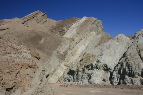 Tilted strata on the way out.