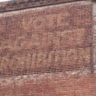 Faded sign.