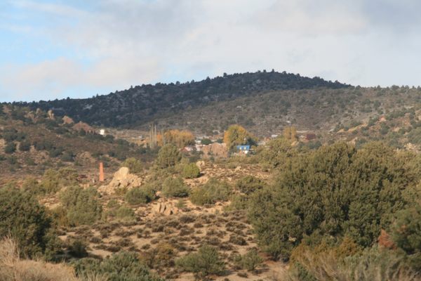 View of Belmont coming in from the south.  Note the red brick chimney of the Monitor-Belmont mill to the left.