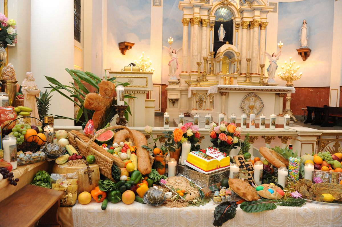 Altars include bread sculptures in the form of religious symbols.