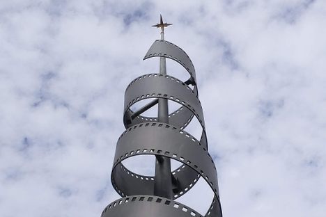 The spiral is meant to evoke a roll of film.