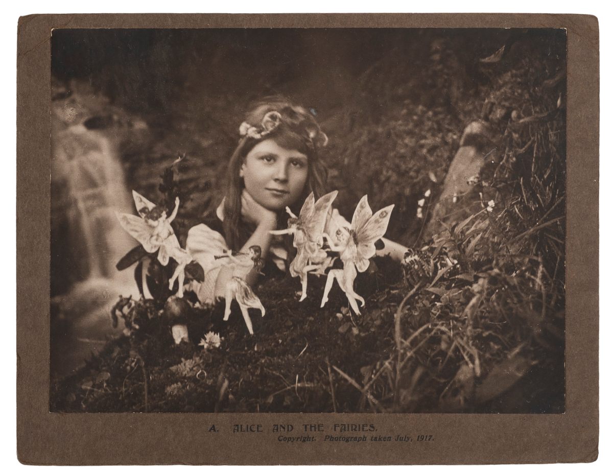 Elsie Wright photographed her cousin, Frances Griffths, surrounded by fairies in July 1917.