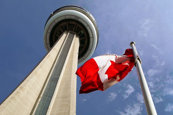 CN Tower with the Canadian flag