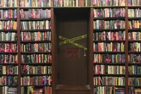 The door to Otto Penzler’s office in the Mysterious Bookshop, marked by police tape.