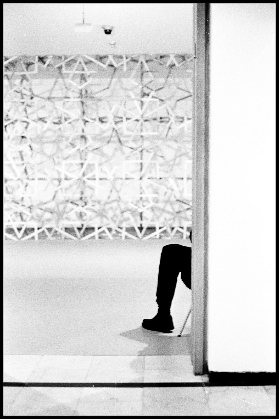 A guard blends into the experience at at the Tel Aviv Museum of Art.