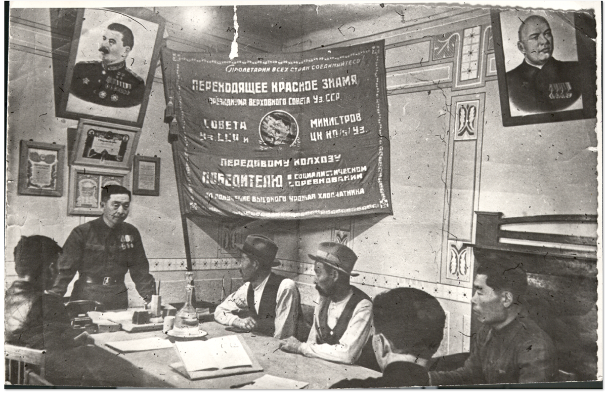 Kim Pen Hwa, the decorated chairman of a Korean collective farm (<em>kolkhoz</em>), in a meeting with staff, early 1950s.