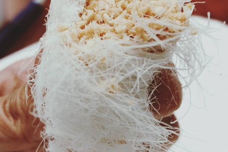 A close-up of the candy's fine strands and crunchy filling.