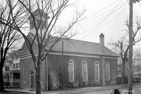 The First Baptist Church was torn down in 1957 and replaced by a parking lot.
