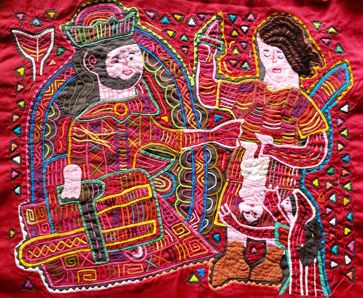 This intricate mola depicts the biblical story of Solomon proposing to cut a baby in half to settle a dispute between two mothers.