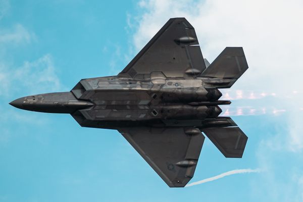 U.S. Air Force Capt. Samuel “RaZZ” Larson, F-22 Raptor Demonstration Team commander, passes over the flight line at Joint Base Langley-Eustis, Virginia, July 9, 2024