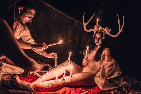 Living candelabras sat or stood unflinching as hot wax dripped onto their bodies, forming incredible sculptures and shapes.