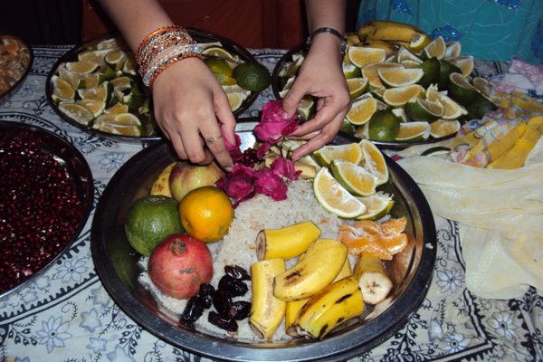 Bene Israel Jews prepare malida platters for thanksgiving ceremonies for the Prophet Elijah.