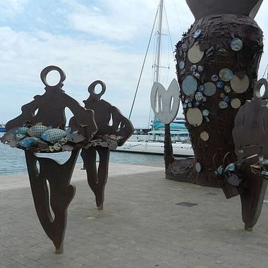 Three fishermen, with partial views of the mermaid in the back.