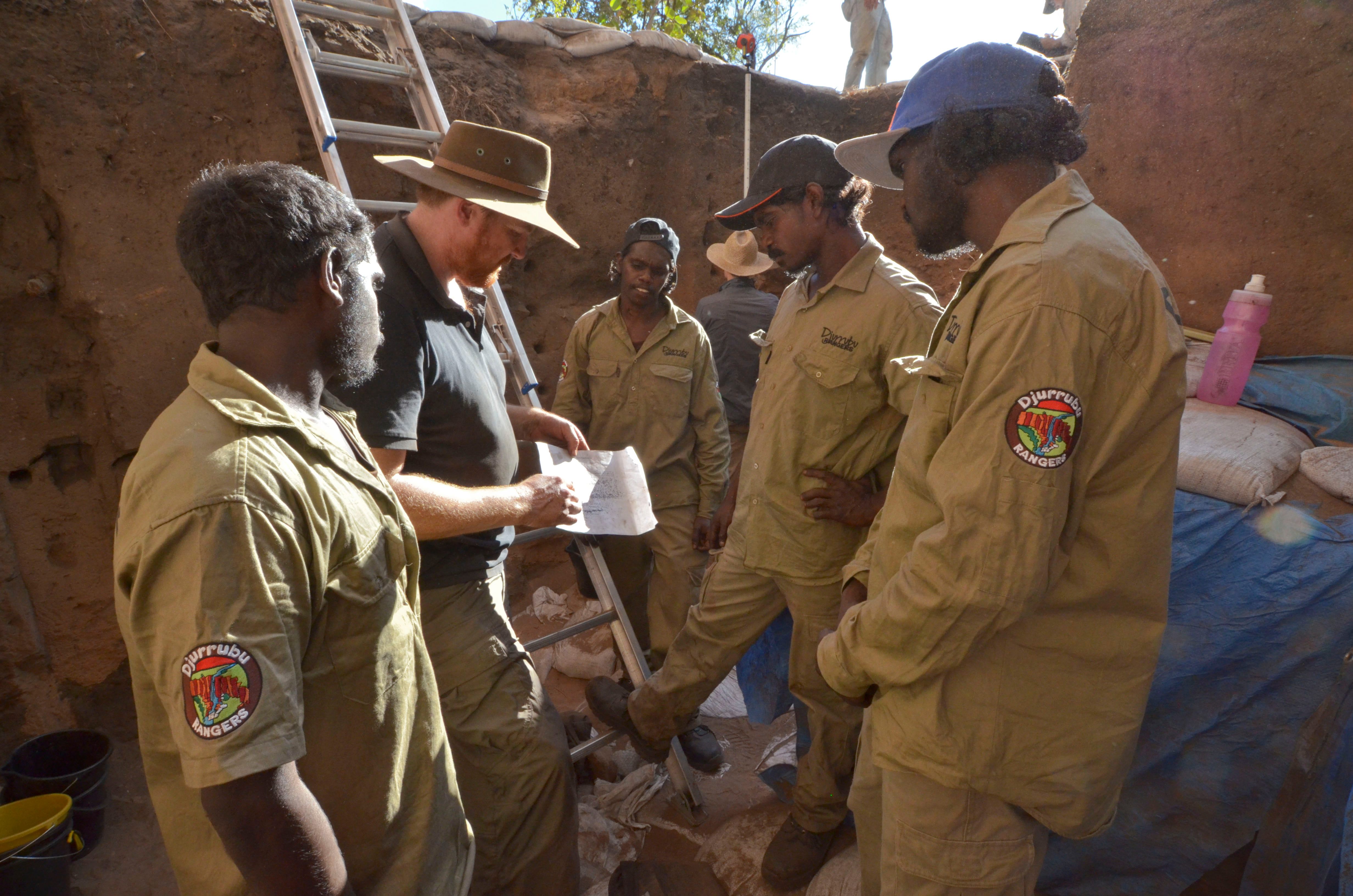 Archaeologists and park rangers in the excavation site in northwest Australia.