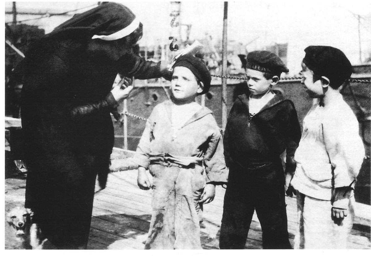 Civita with three boys from the ship.
