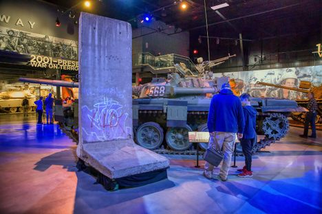 A segment of the Berlin Wall next to an East German T-72 tank.