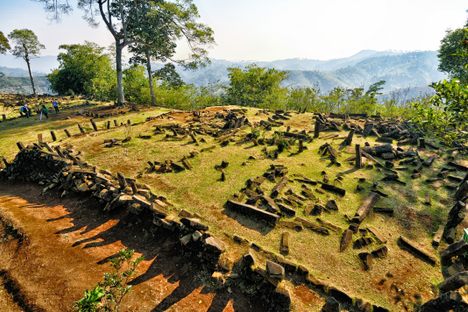 New research says humans began sculpting a small hill into a larger pyramid around 6,000 BC, and then building layers of sand and rocks on top of that.