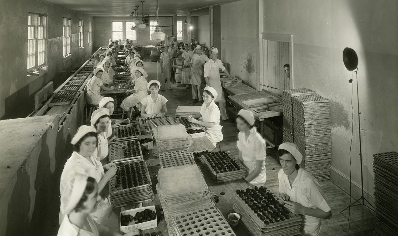 The cupping and hand dipping room for Reese's Peanut Butter Cups, c. 1935.
