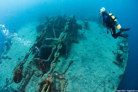 A diver drifts above the Thistlegorms bow winch