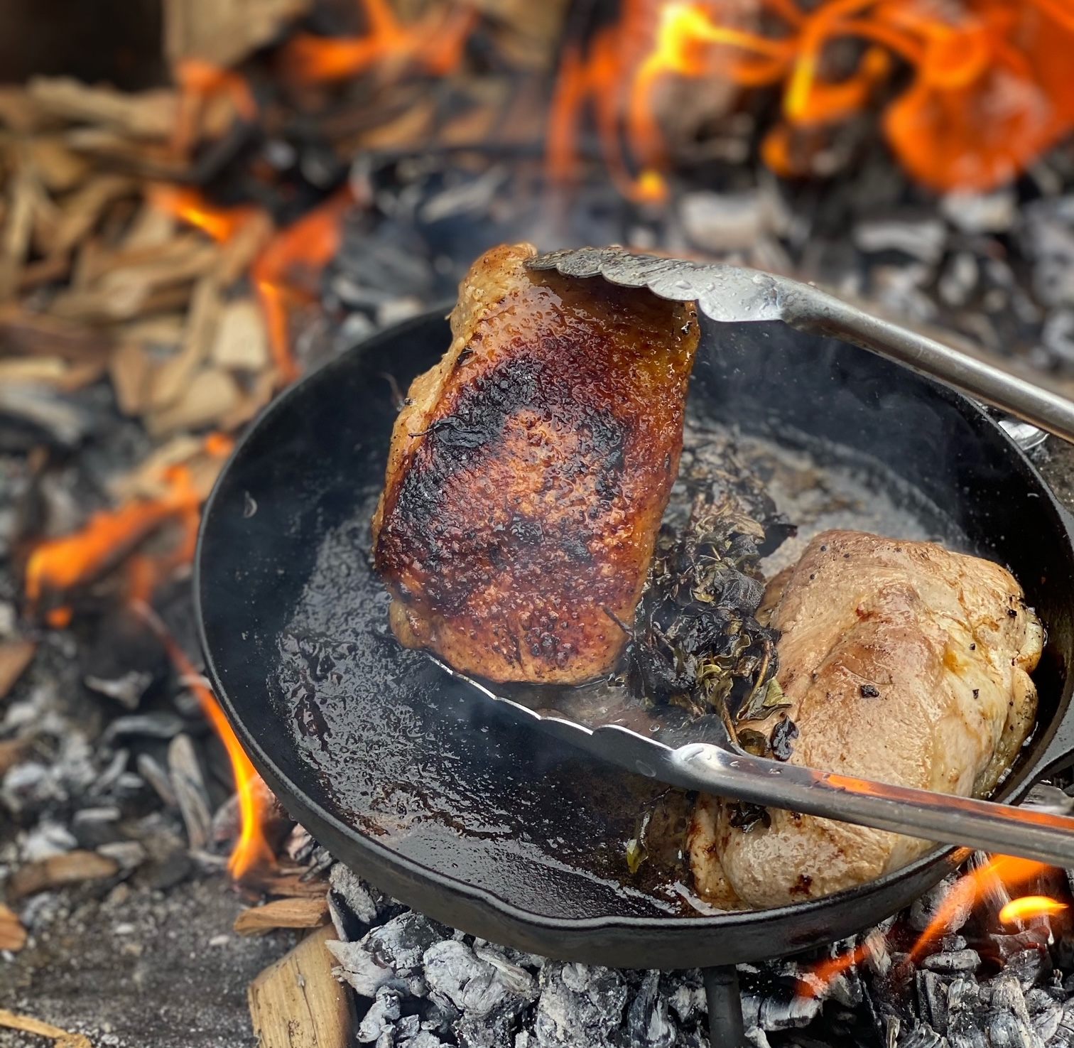 The duck gets seared with oil, fish sauce, and herbs.