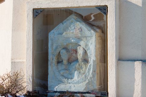 The Roman gravestone mounted in the wall of the church.